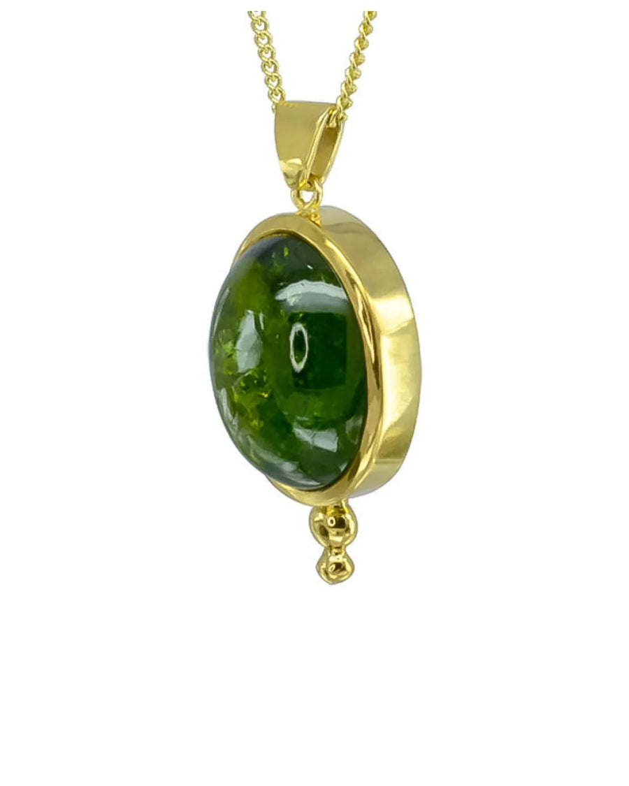 Oval green tourmaline pendant set in 9ct yellow gold with drop detail on gold chain