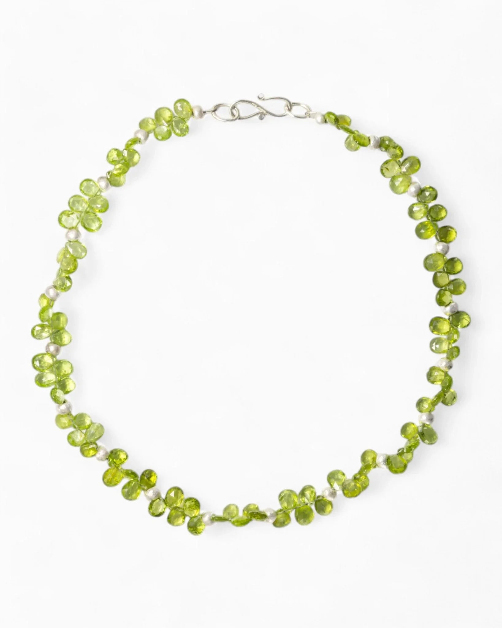 Handmade teardrop green gemstone necklace with organic clustered design on white background