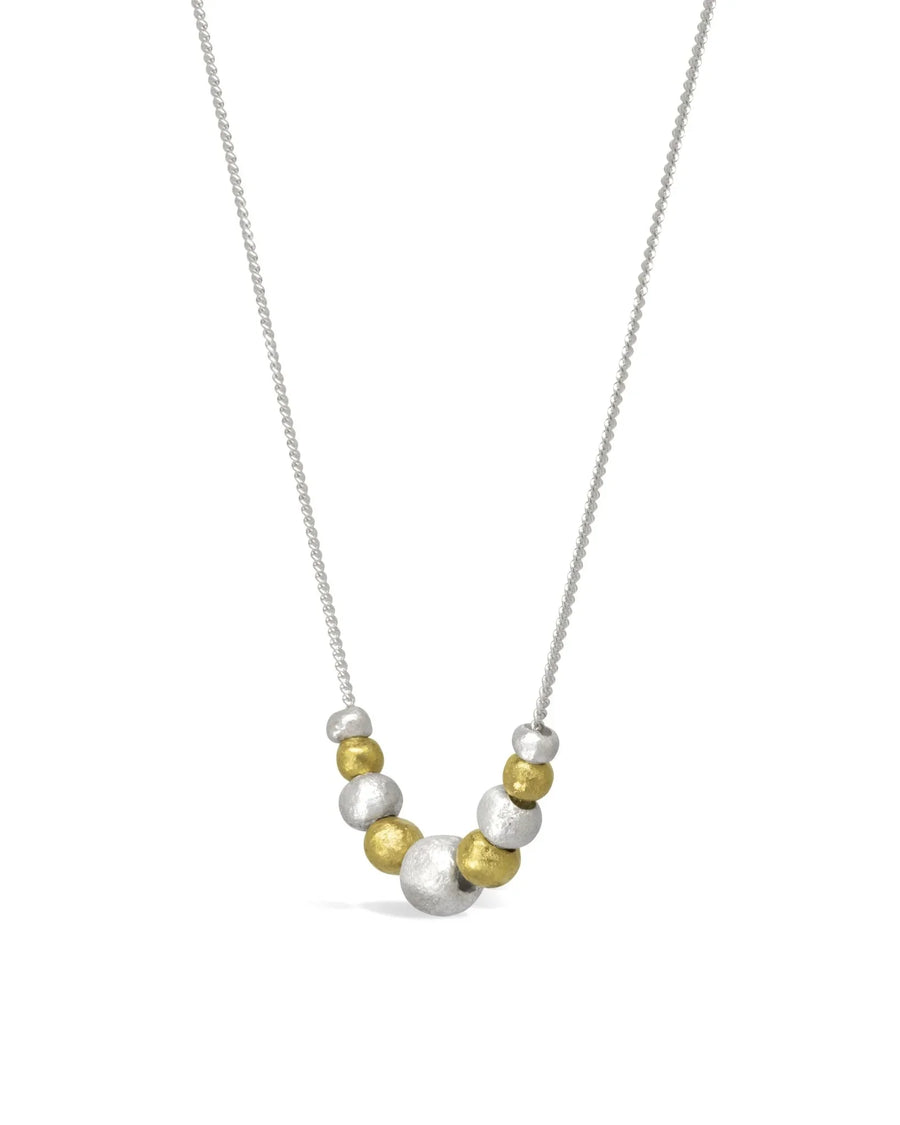 Gold and silver nugget pendant necklace with organic textured beads on a chain