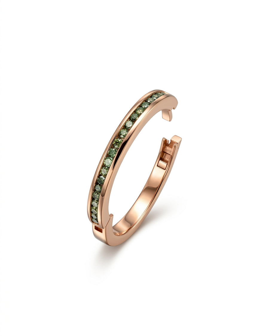Rose gold hinged eternity ring with green diamonds.