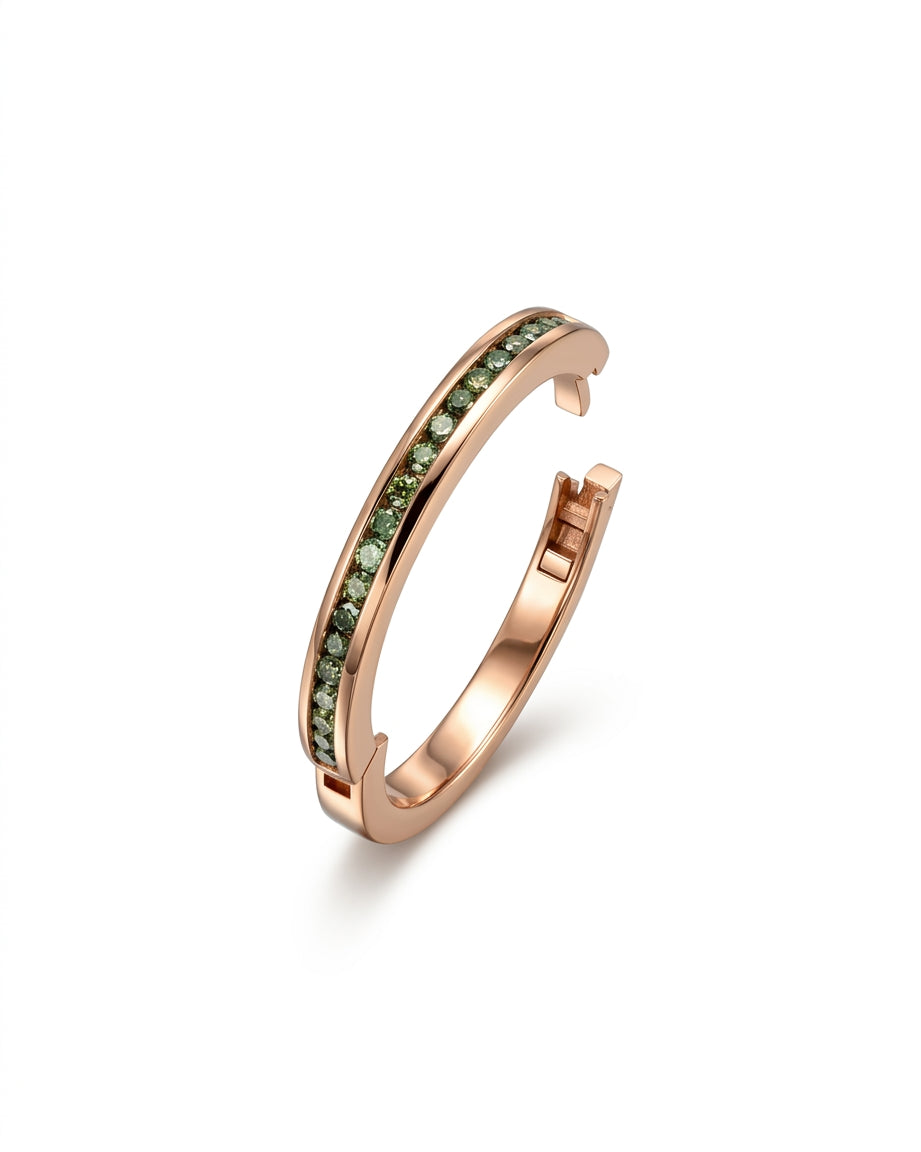 Rose gold hinged eternity ring with green diamonds.