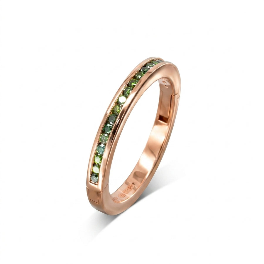 Rose gold hinged eternity ring with green diamonds.