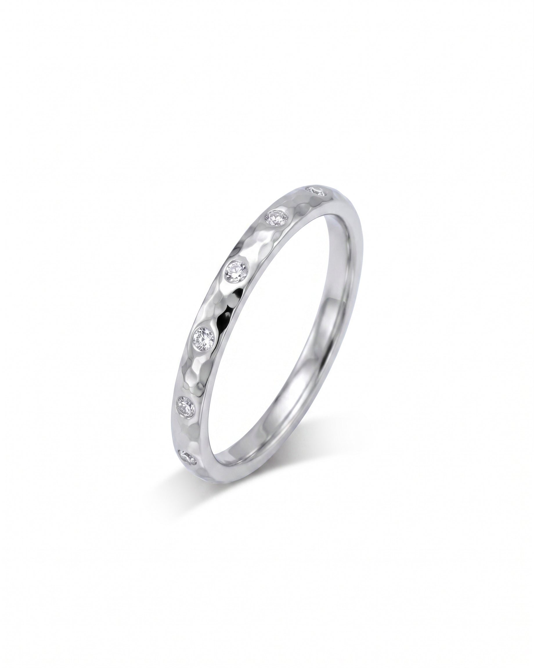 Silver hammered diamond ring with round brilliant cut diamonds.
