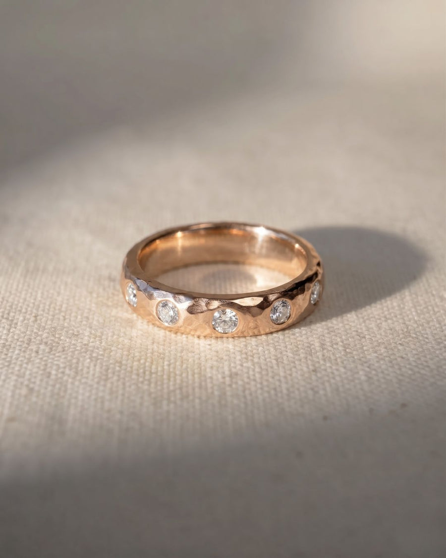 9ct rose gold hammered diamond ring with five round diamonds.