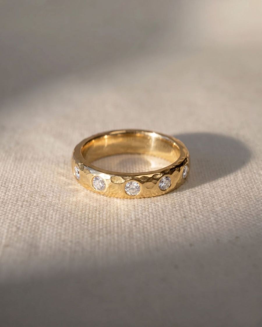 9ct yellow gold hammered diamond ring with five round diamonds.