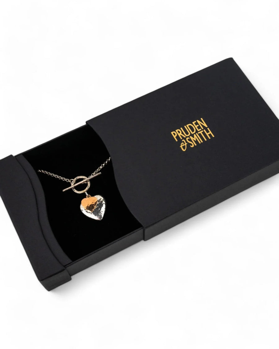 Hammered silver and rose gold double heart pendant necklace in a black gift box