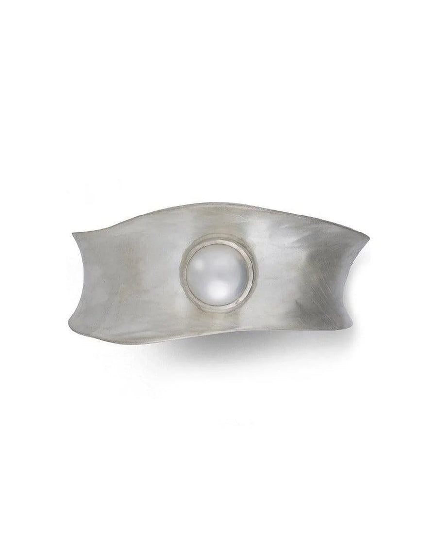 Silver cuff bangle with a white mabe pearl.