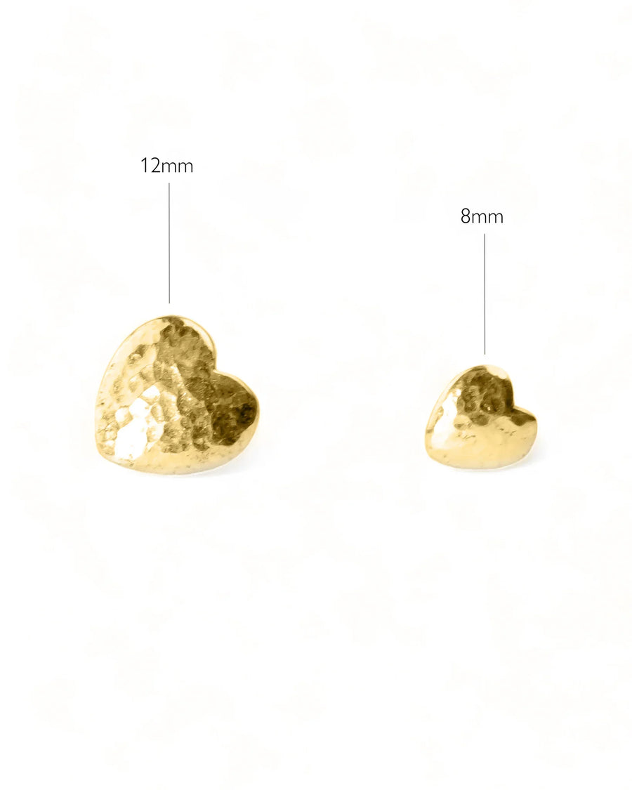 Two hammered gold heart stud earrings, one 12mm and one 8mm.