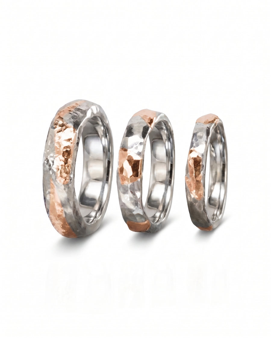 Hammered mixed metal court rings in silver and 9ct rose gold, varying widths.