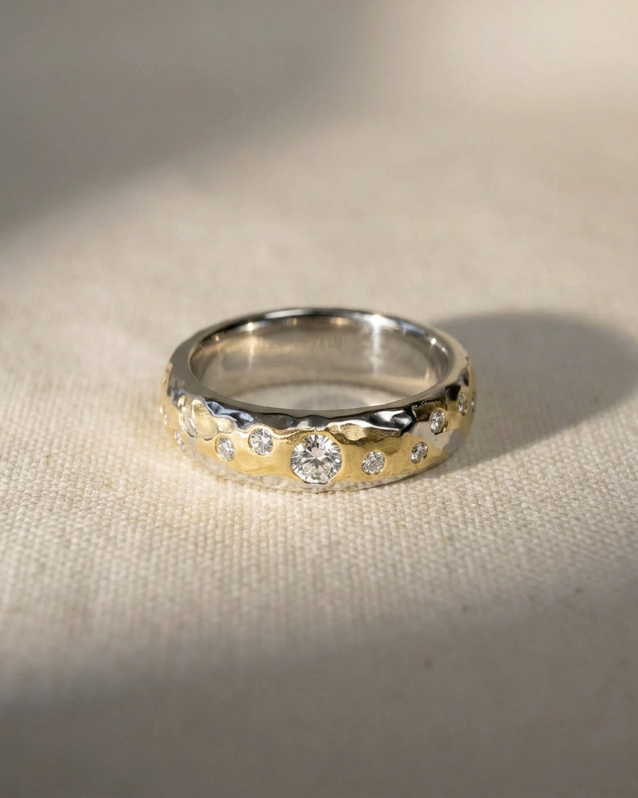 Hammered mixed metal gold and silver diamond ring.