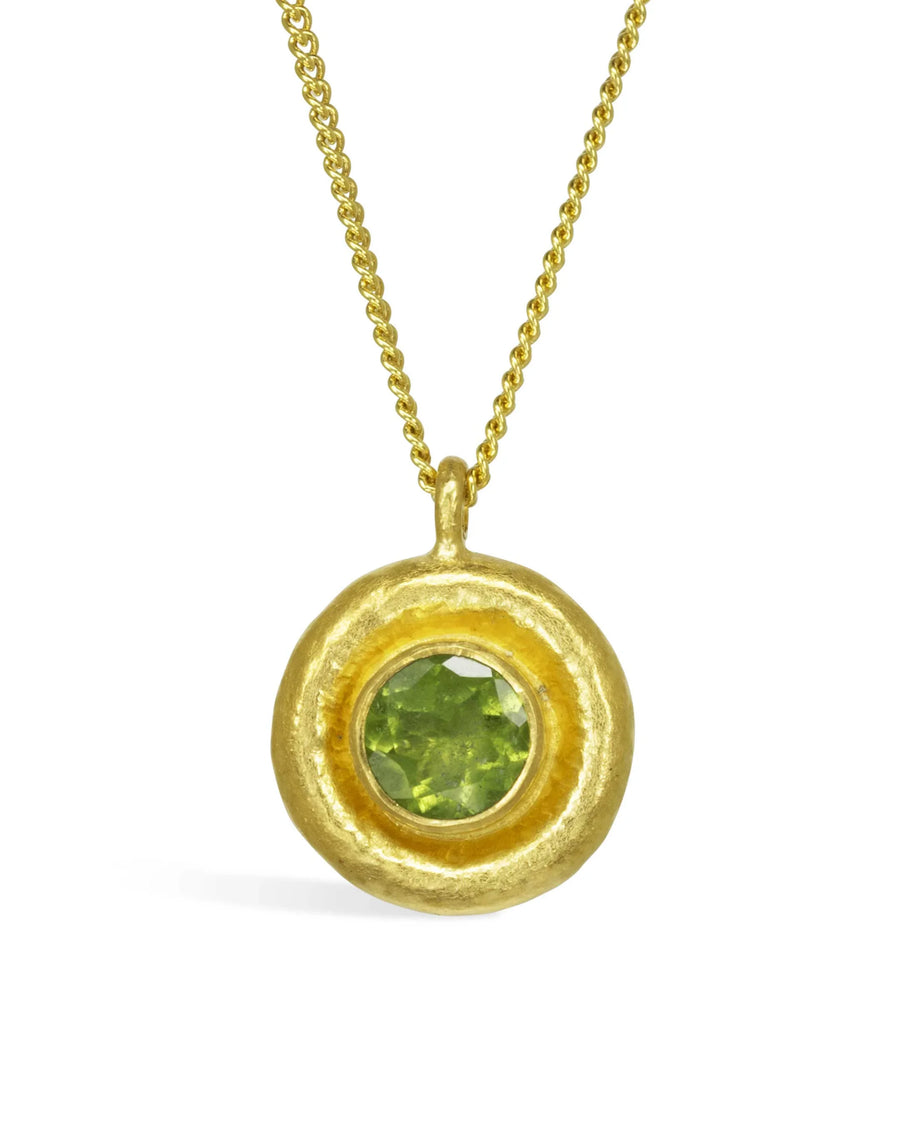 Handcrafted gold pendant necklace with round green peridot gemstone and textured finish