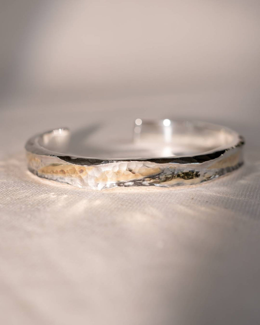 Hammered silver and 9ct rose gold cuff bangle.