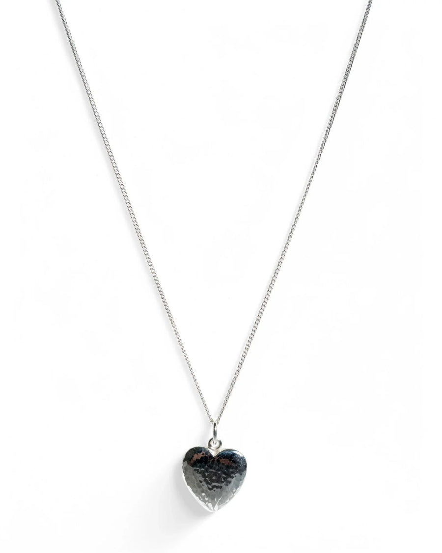 Handmade silver heart pendant necklace with hammered texture on a white background