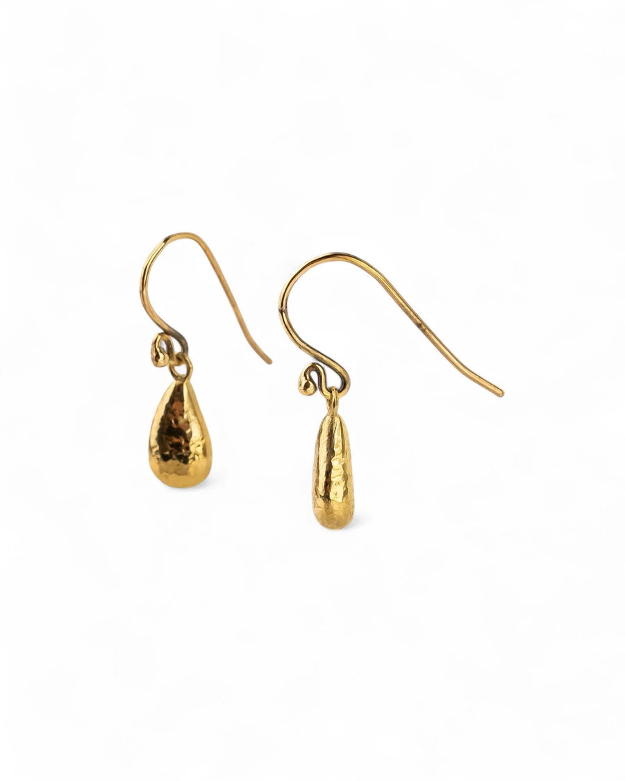 Hammered teardrop 9ct yellow gold drop earrings with organic texture on white background