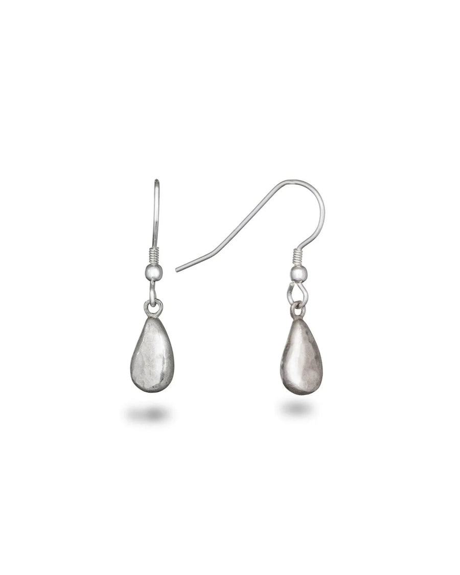 hammered silver teardrop dangly earrings with organic texture on white background