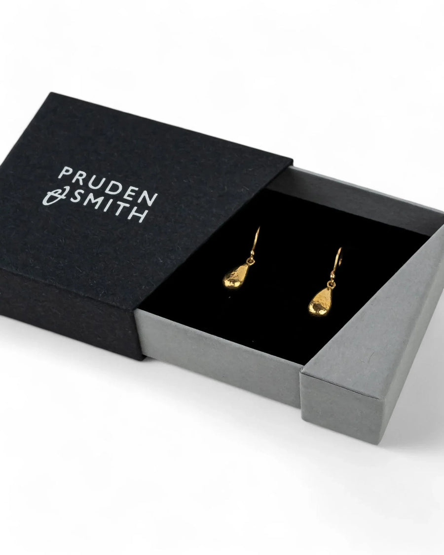 Hammered yellow gold teardrop drop earrings in a gift box, elegant and textured