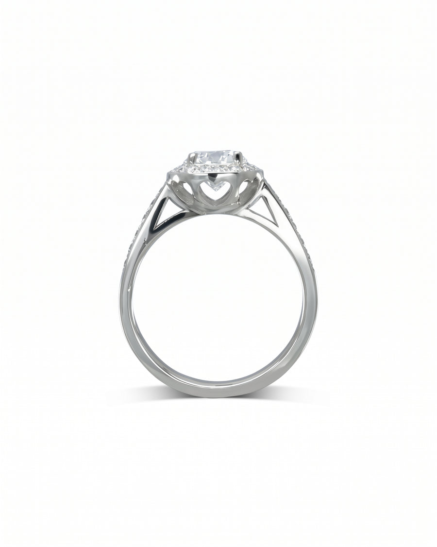 Silver heart diamond cluster engagement ring with set diamonds.
