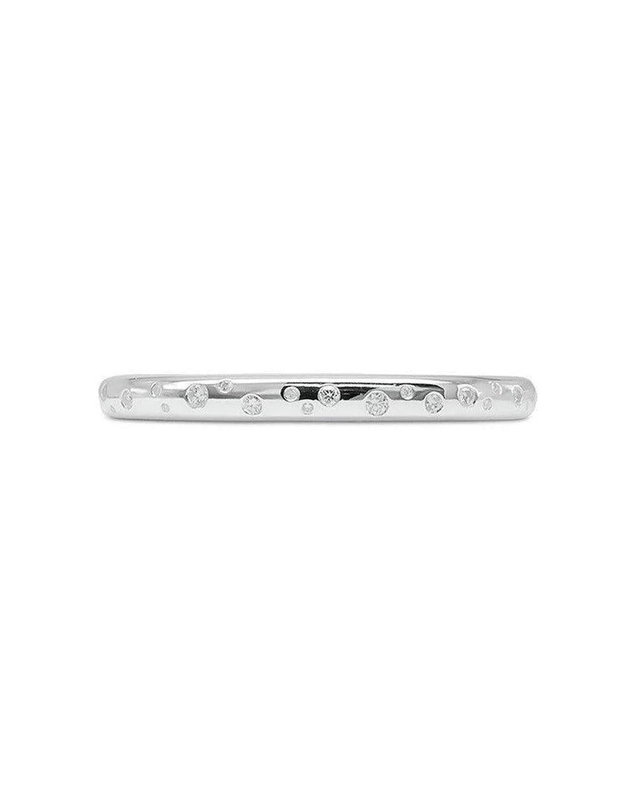 Solid silver bangle with scattered diamonds.