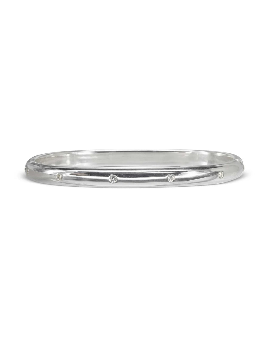 Solid silver hinged bangle with scattered diamonds.