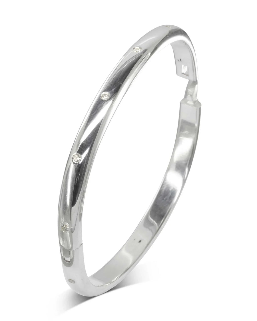 Hinged solid silver bangle with diamonds set evenly around the band.