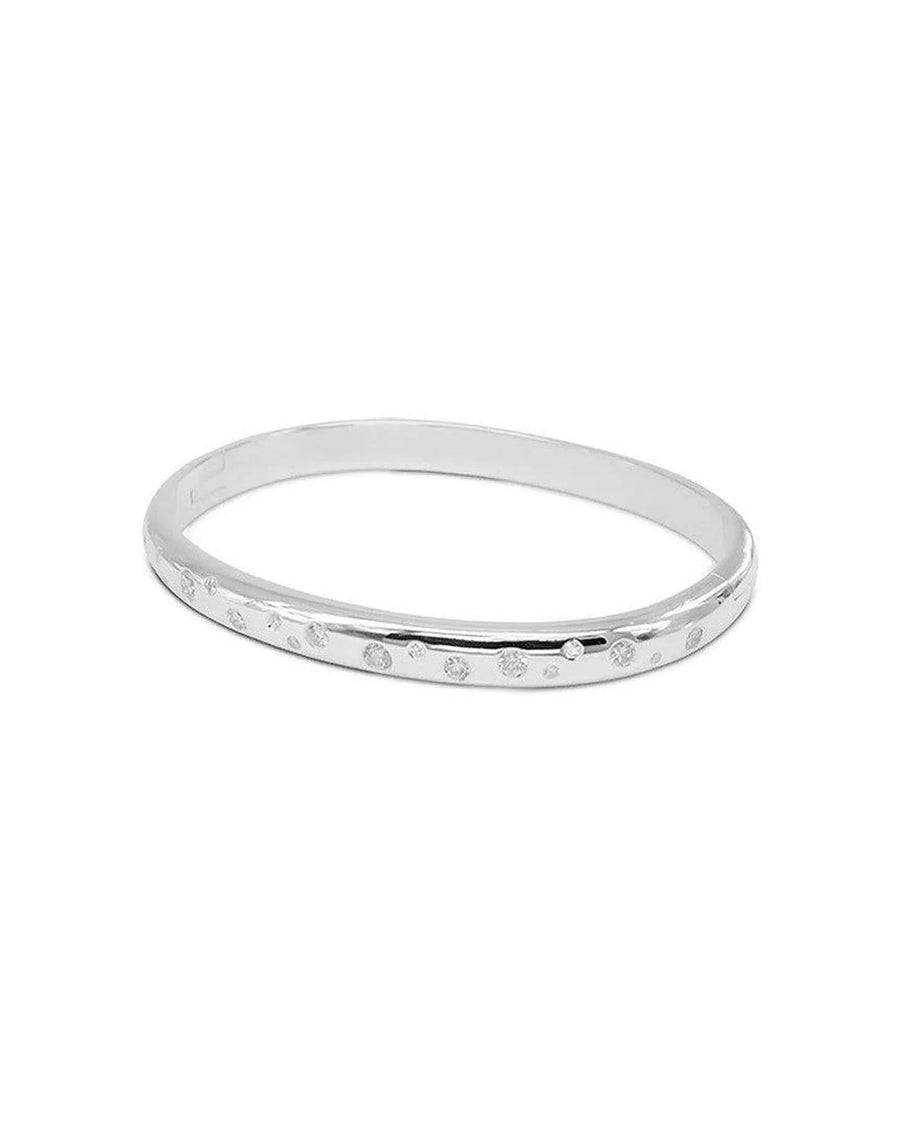 Solid silver hinged bangle with randomly scattered diamonds on one side.