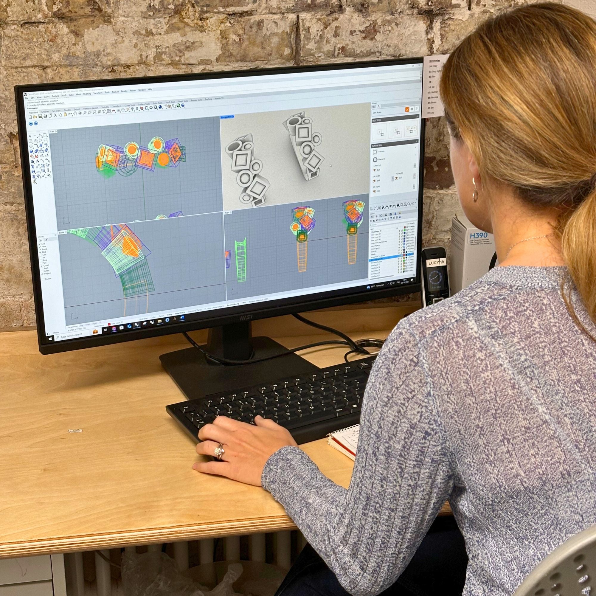 Lucy at the desk doing a CAD jewellery remodelling design.