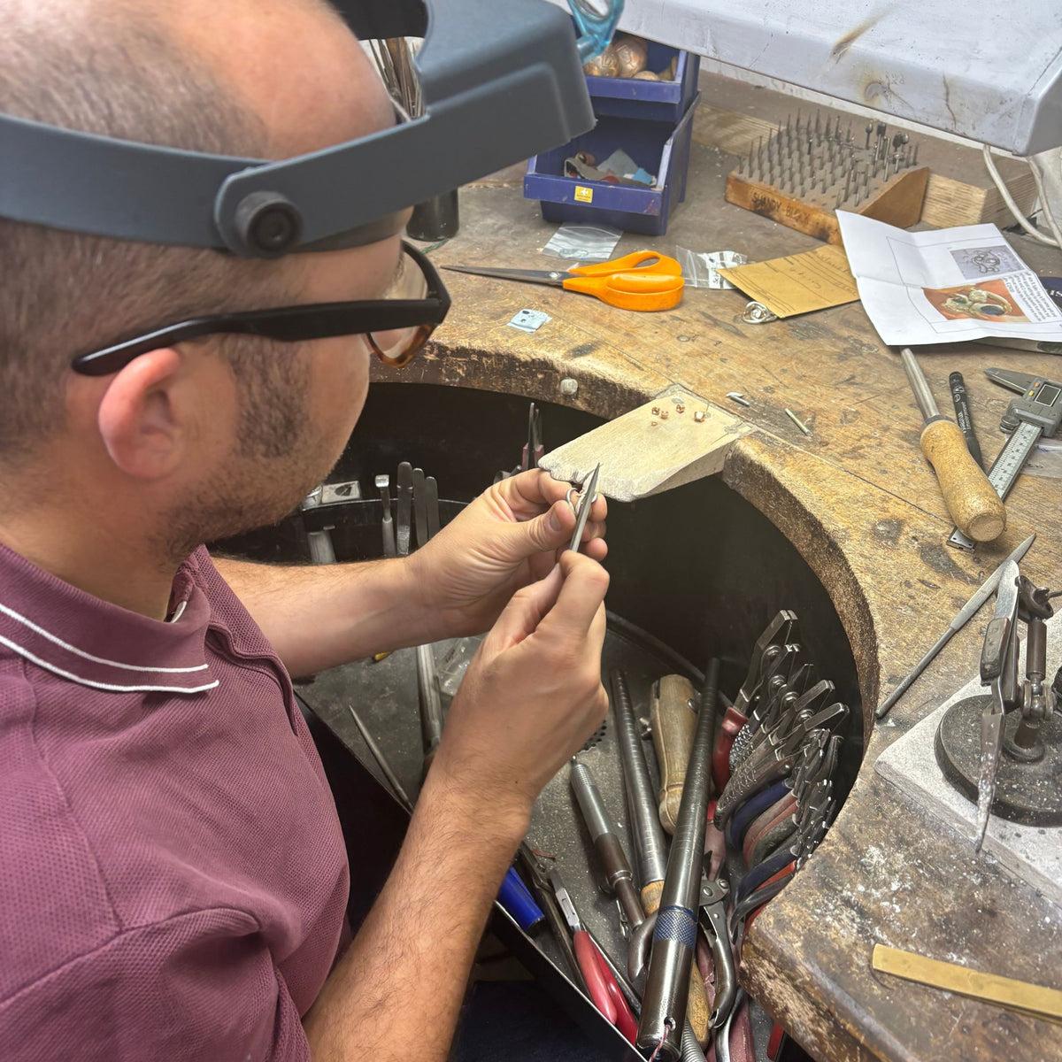 Head goldsmith Simon at the bench doing a jewellery remodelling design