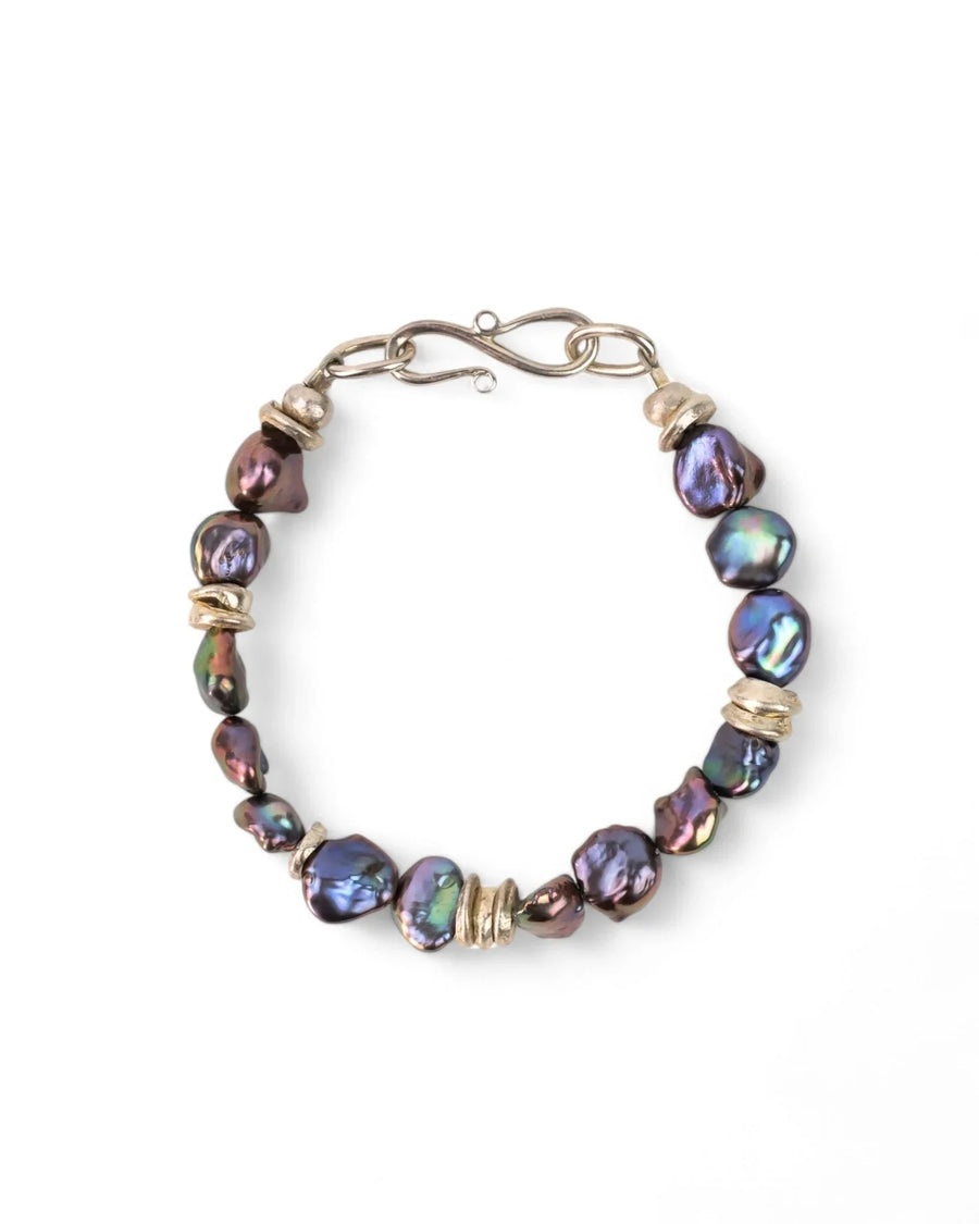 Handmade bracelet with irregular black keshi pearls and silver textured beads