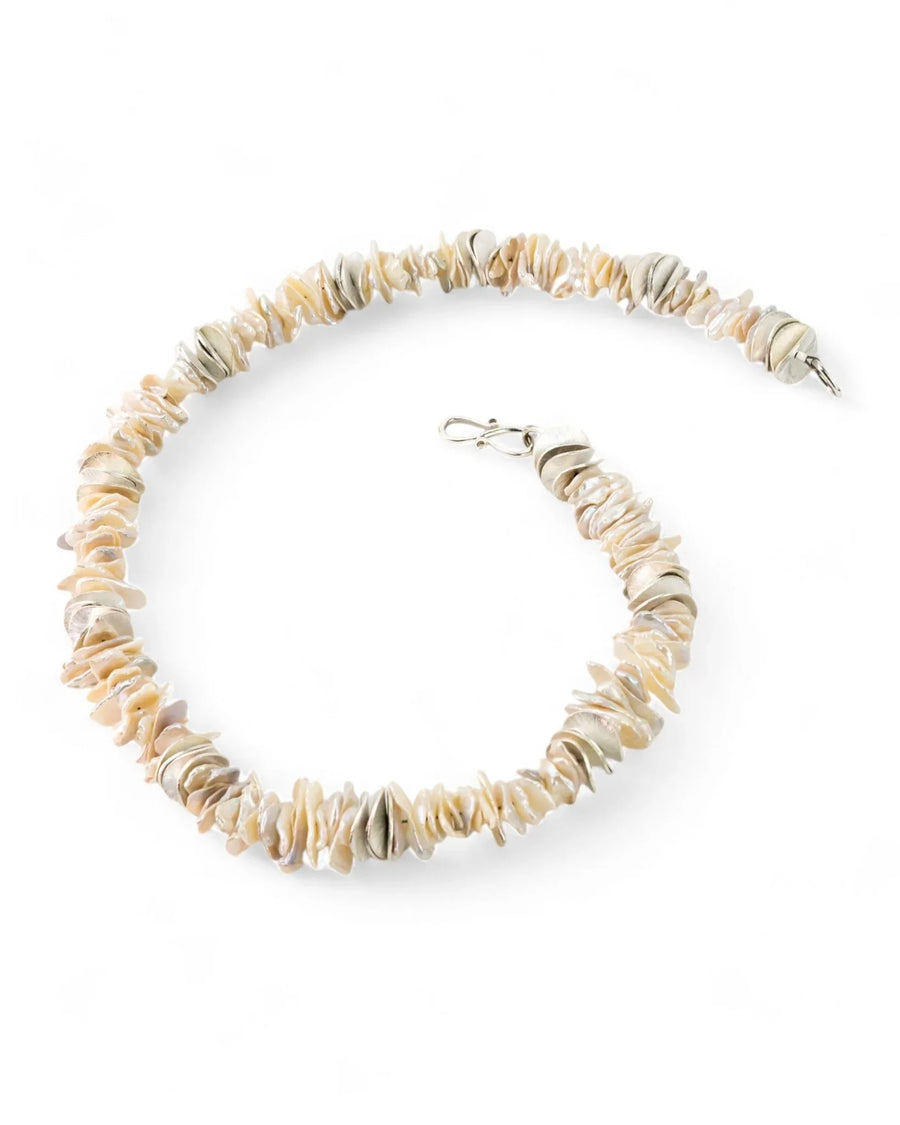 Keshi pearl and silver disc necklace with a silver clasp.