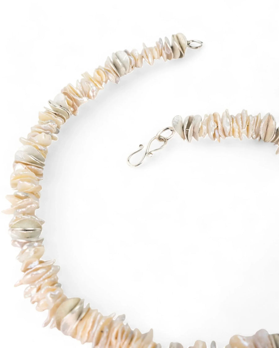 Keshi pearl and silver disc necklace with a silver hook clasp.