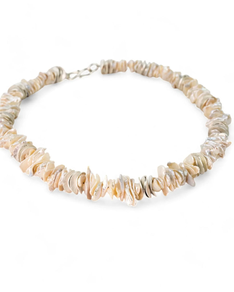 Keshi pearl and silver disc necklace with irregular, natural-shaped pearls.
