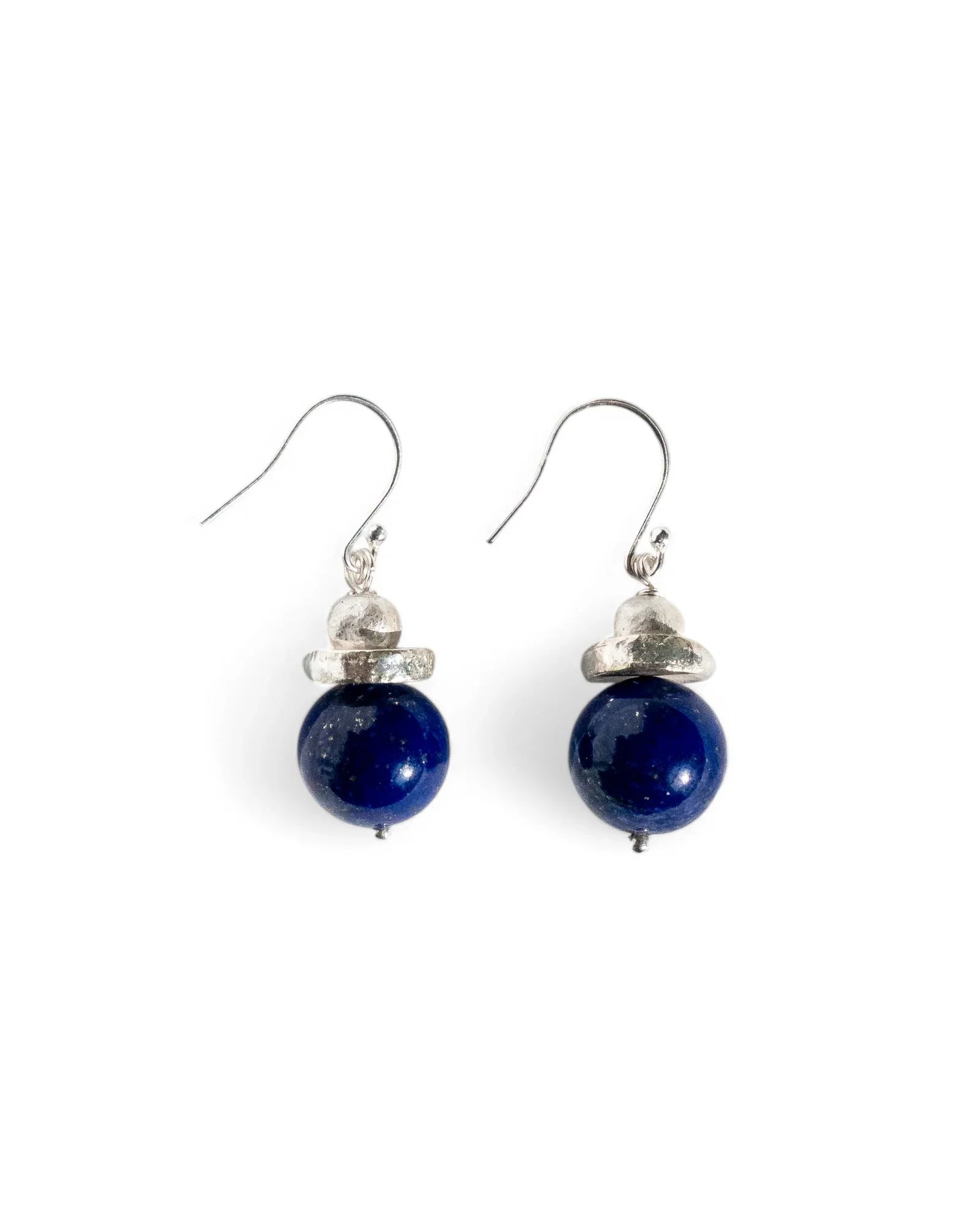 Handmade sterling silver and blue stone drop earrings with organic shapes on white background