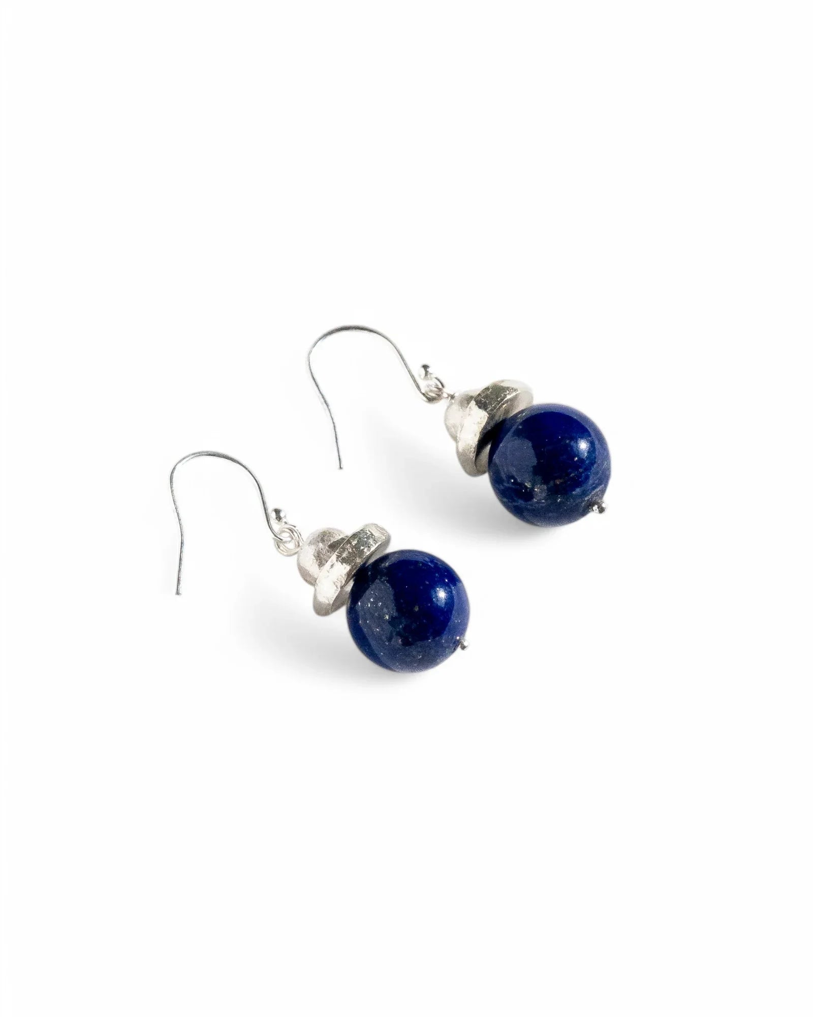 Sterling silver drop earrings with round deep blue stone beads, handmade jewellery on white background