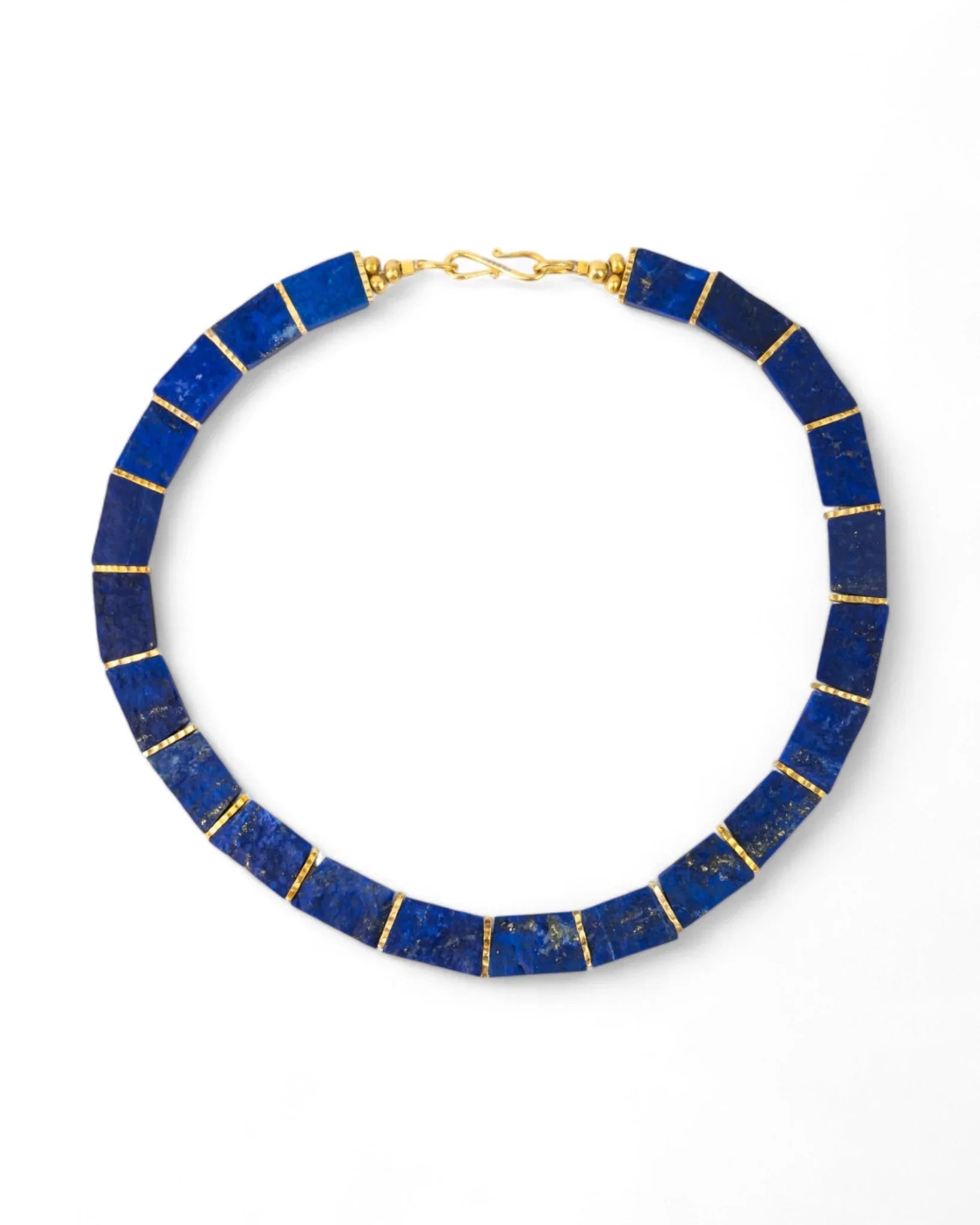 Lapis lazuli collar necklace with gold spacers on a white background