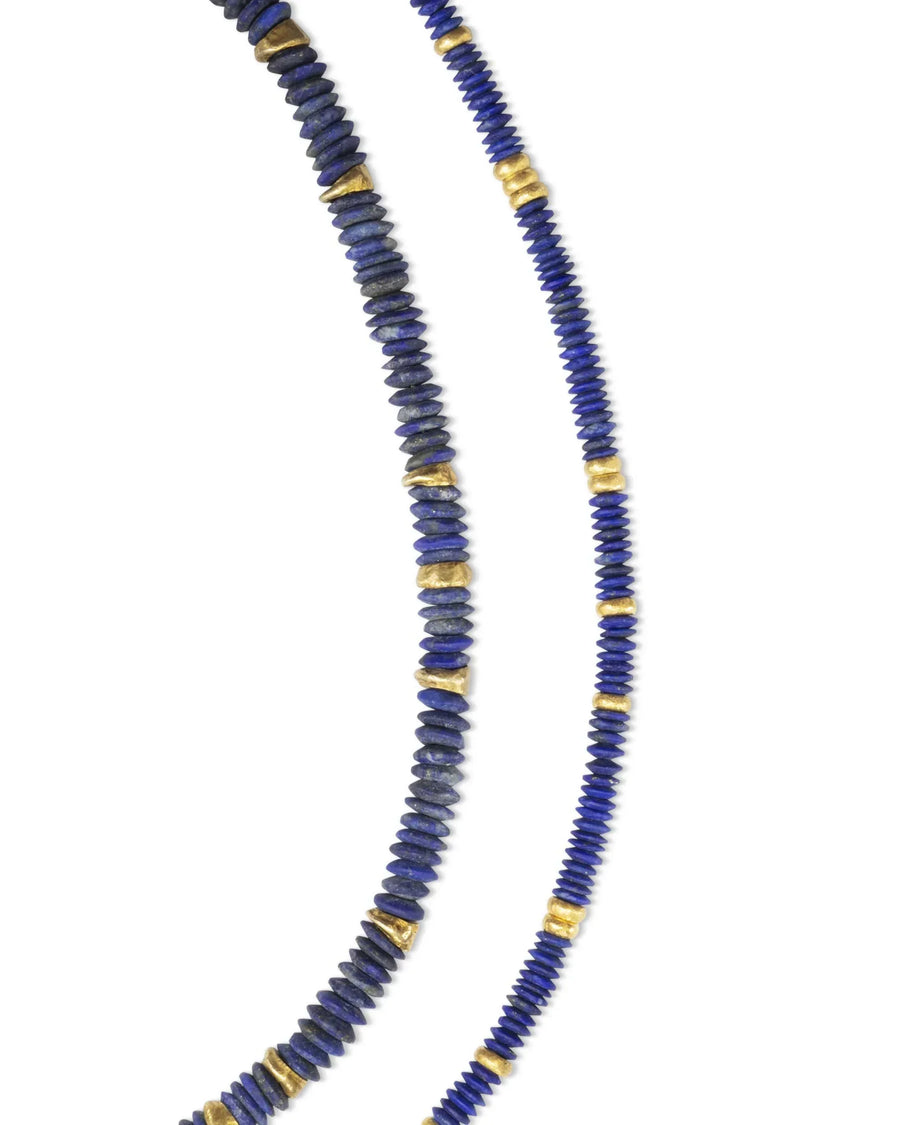 Lapis lazuli disc necklace with gold accents, handmade luxury jewellery on white background