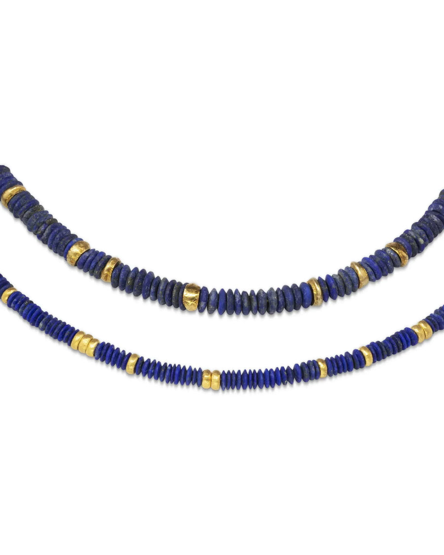 Handmade lapis necklace with organic blue stone discs and textured gold bead accents