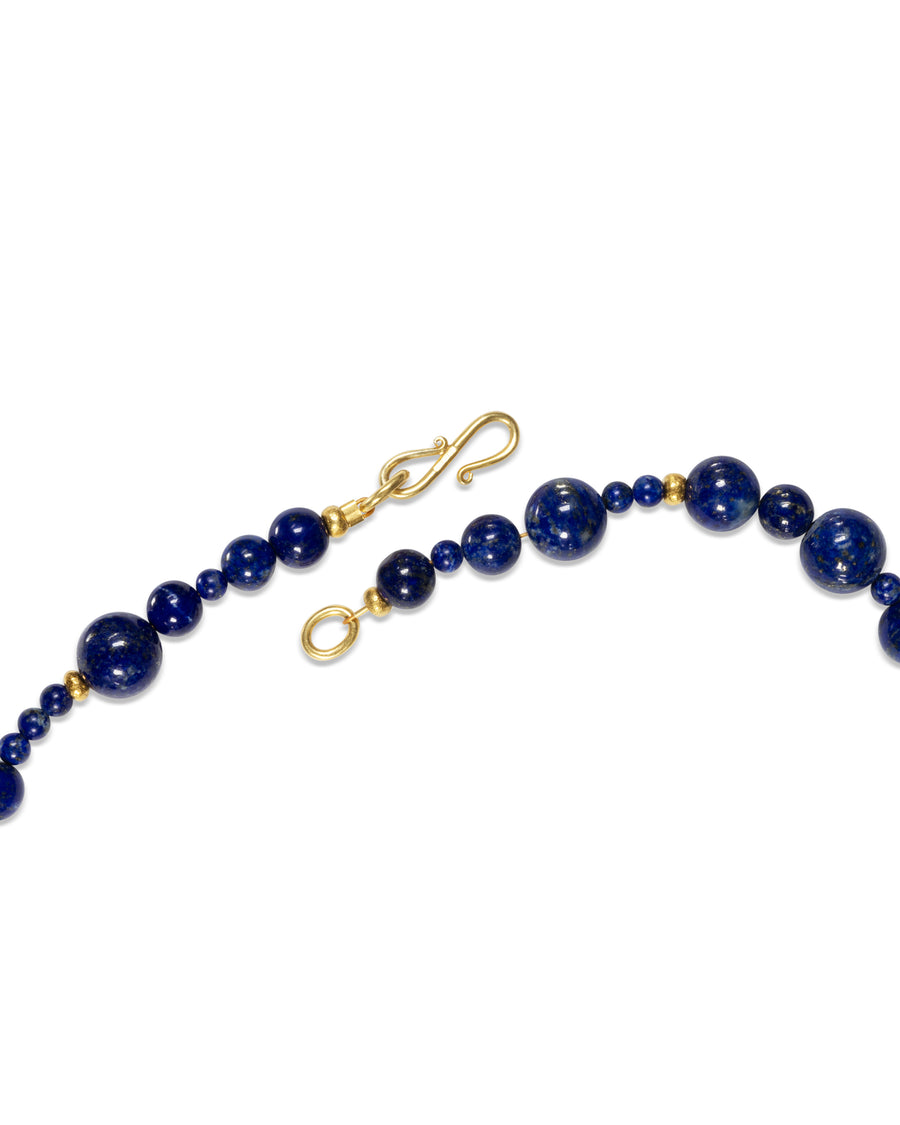 Lapis lazuli gold nugget necklace with a gold hook clasp.