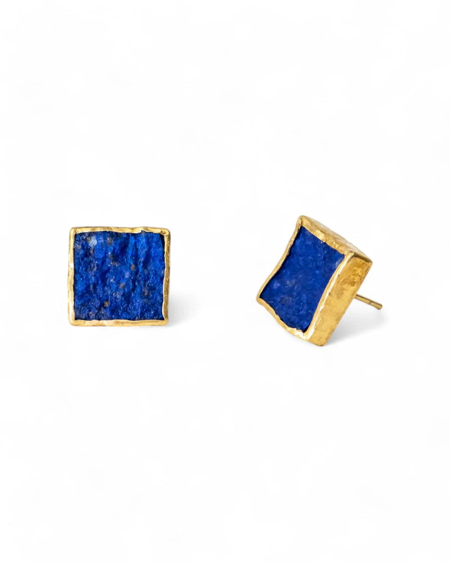 Square lapis lazuli stud earrings with textured gold setting on a white background