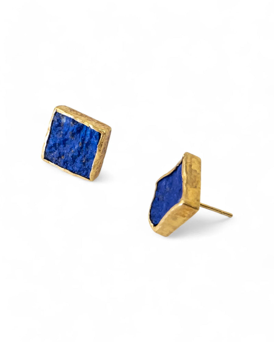 Square lapis lazuli stud earrings with textured gold setting on white background