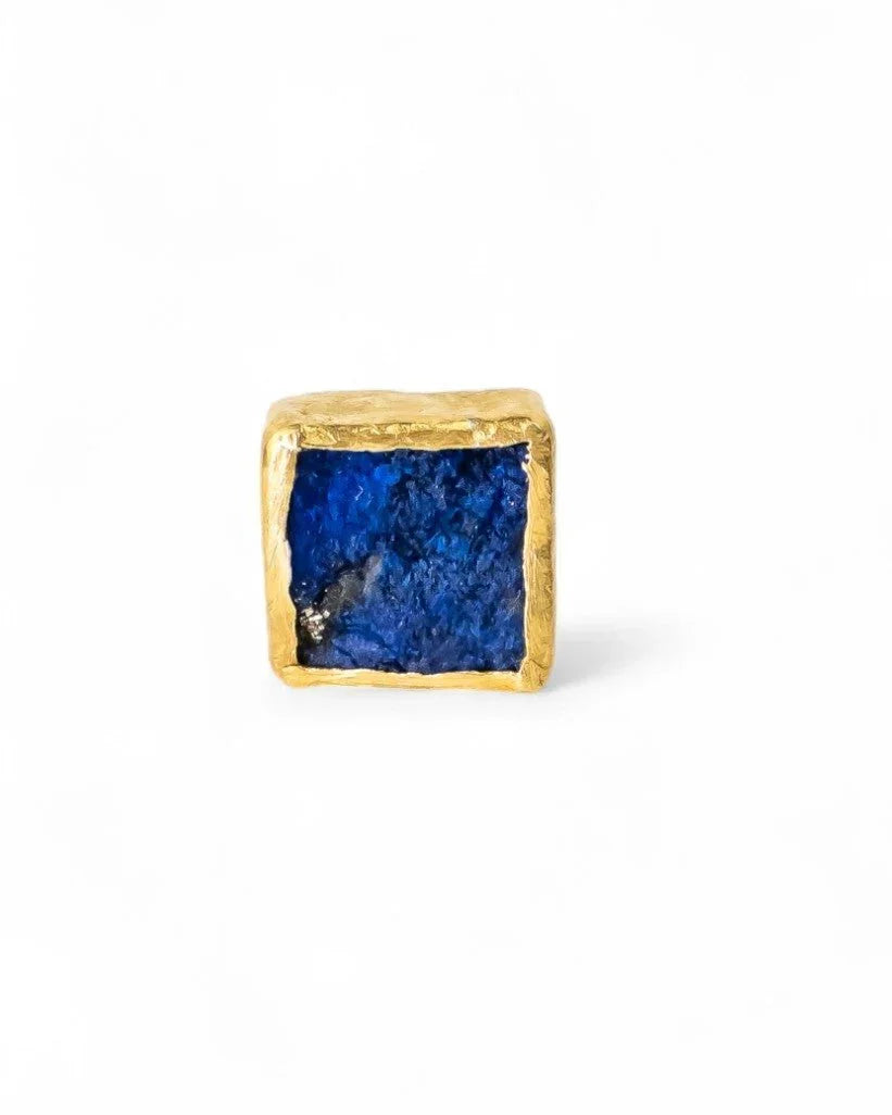 Handmade square lapis lazuli stud earring with textured gold setting on white background
