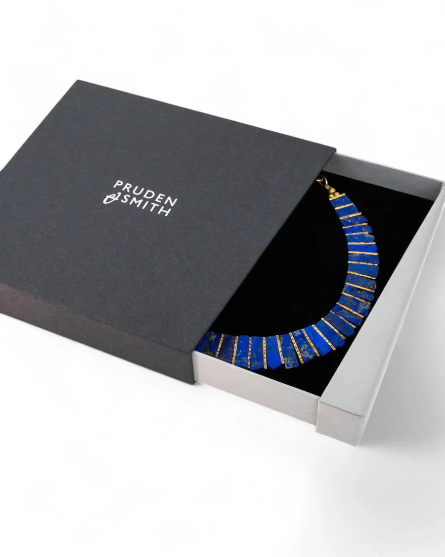 Lapis lazuli tab necklace with gold accents in a luxury gift box