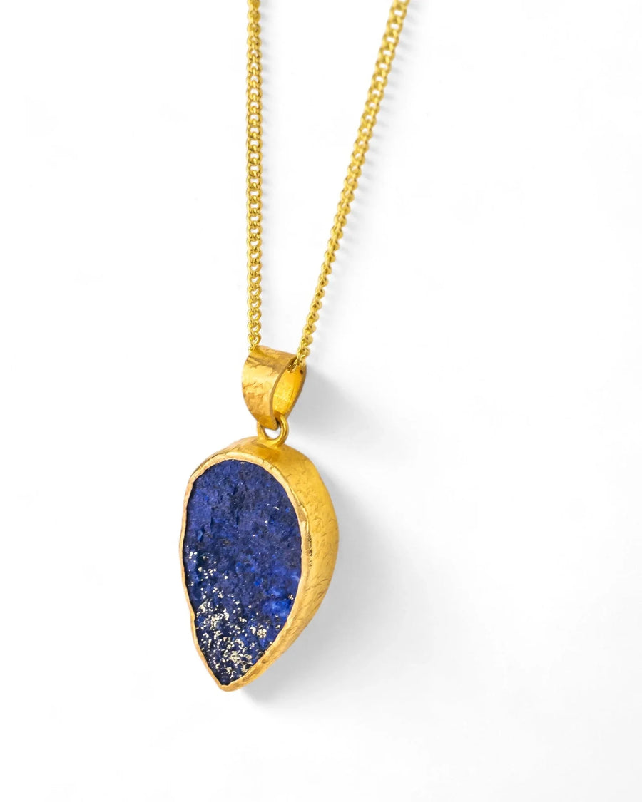 Lapis lazuli pendant in textured yellow gold on a fine gold chain