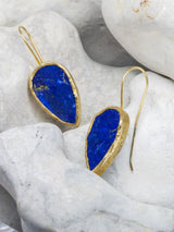 Lapis Lazuli Drop Earrings on Stone Background