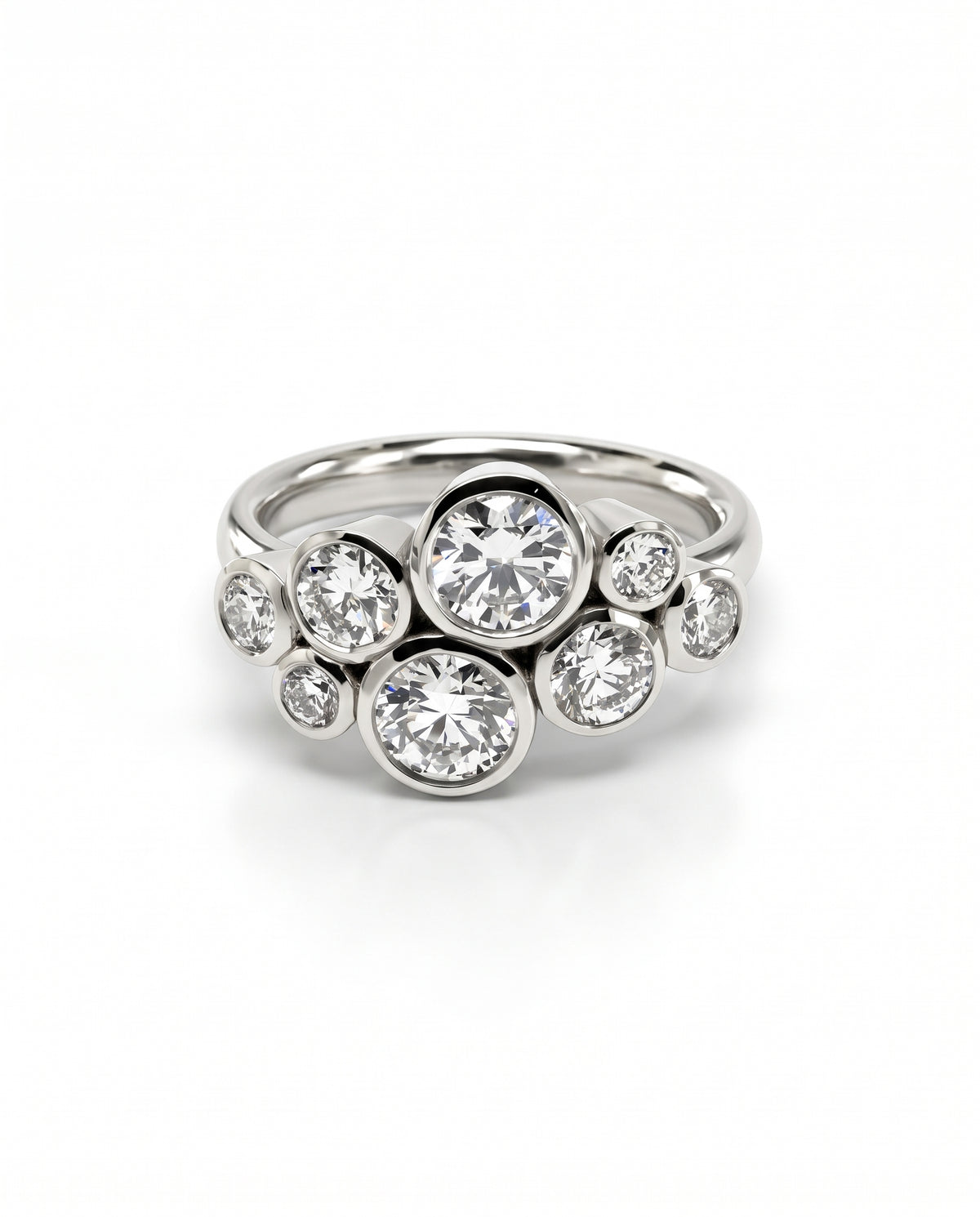 Silver engagement ring featuring a cluster of round diamonds in bezel settings on a polished band.