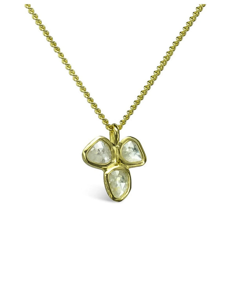Rough diamond trefoil pendant in yellow gold on a twisted chain necklace