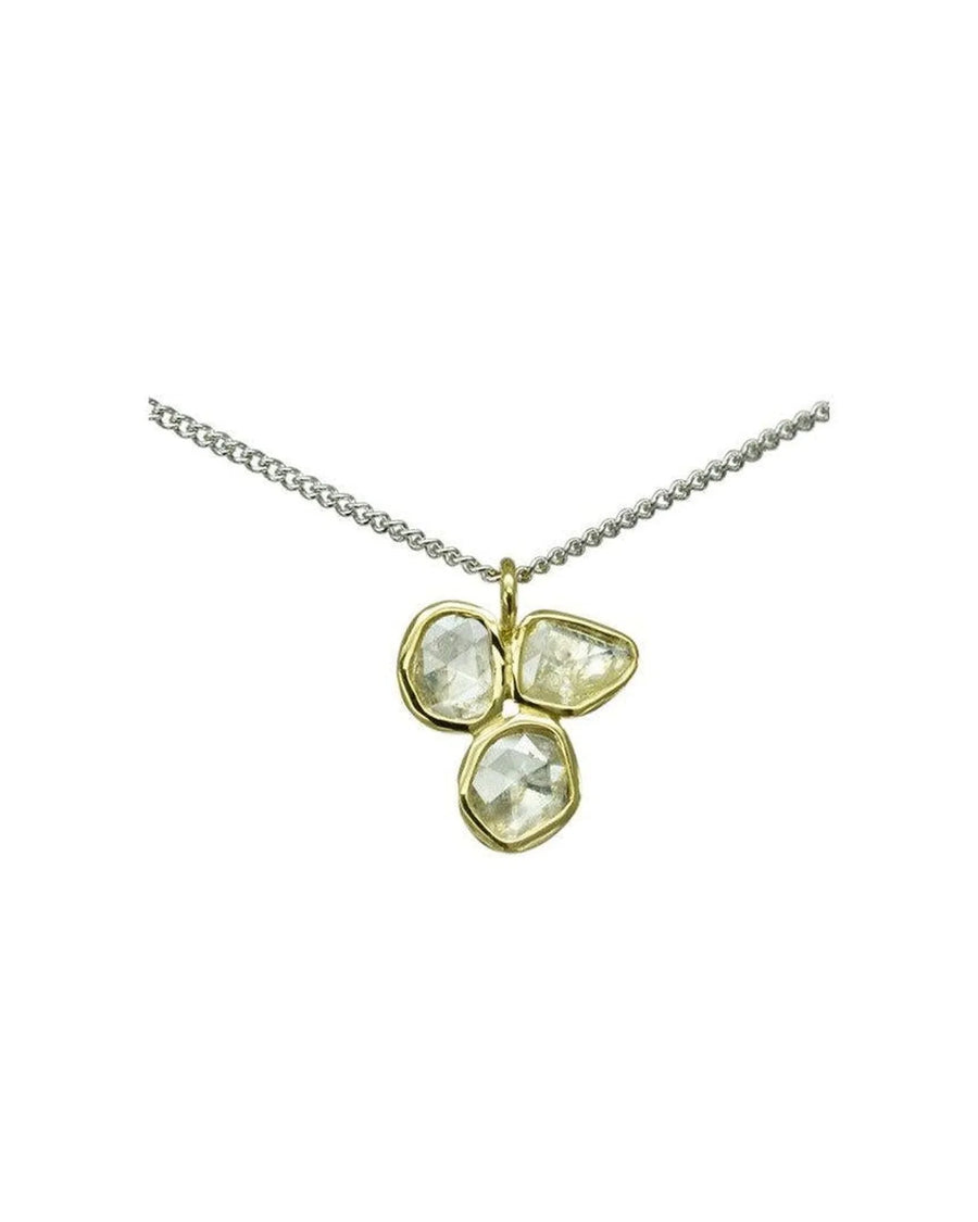 Rough diamond trefoil pendant with three raw diamonds in gold on a silver chain