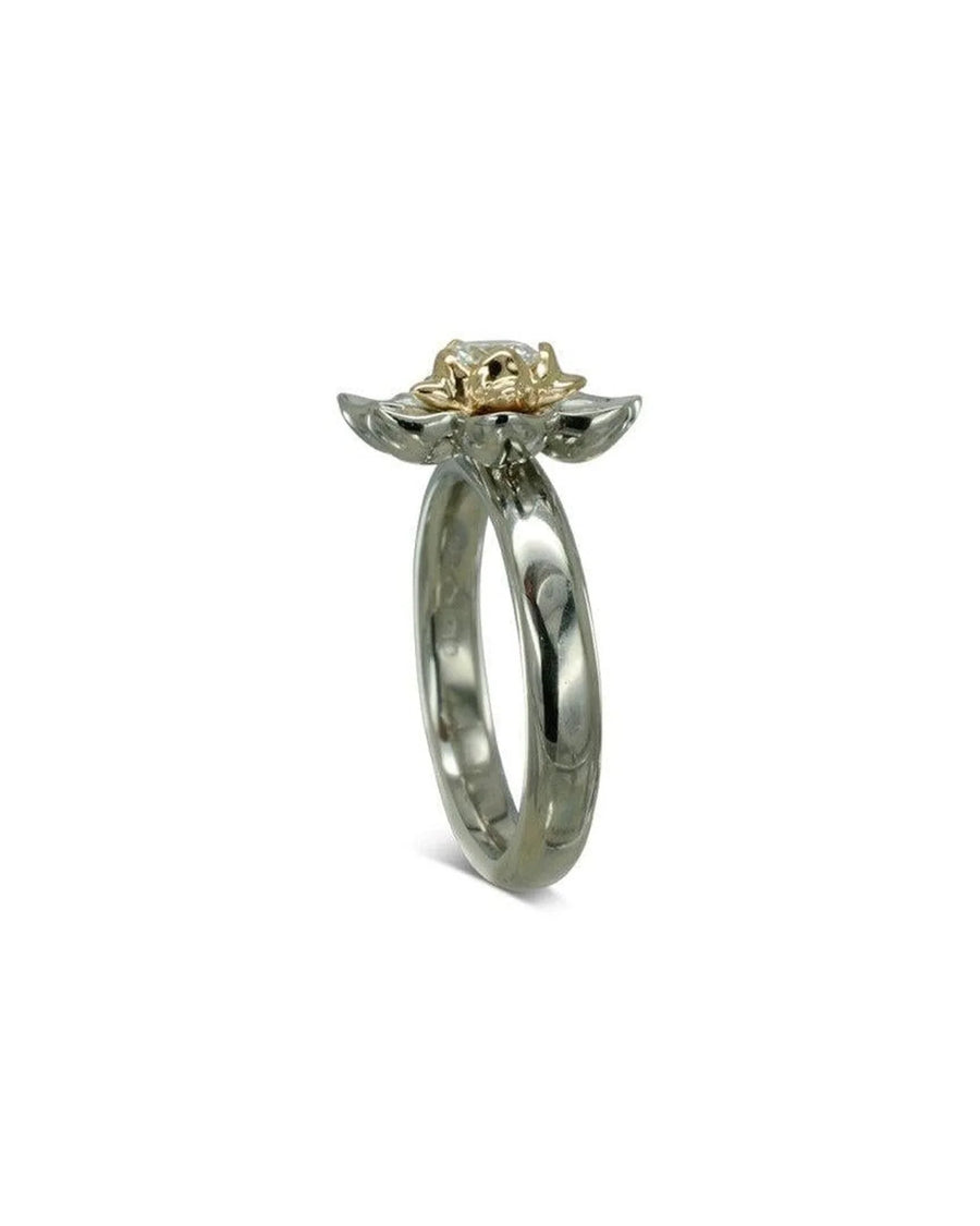 White gold ring with a yellow gold lotus flower cluster and diamond center.