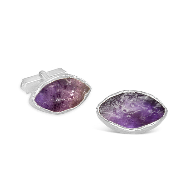 Marquise-shaped cufflinks featuring raw purple amethyst gemstones set in textured silver metal.