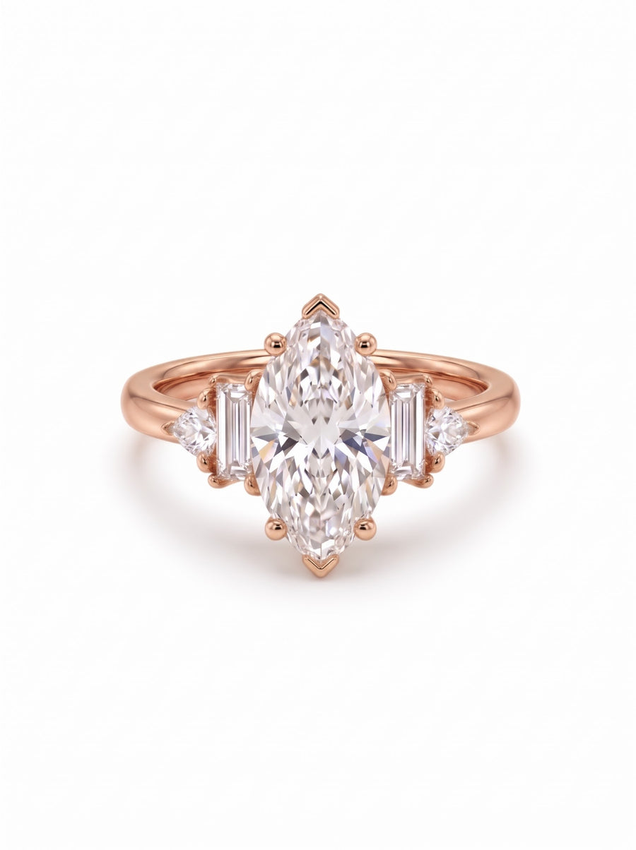 18ct rose gold engagement ring featuring a marquise cut center stone with baguette and trillion side diamonds.