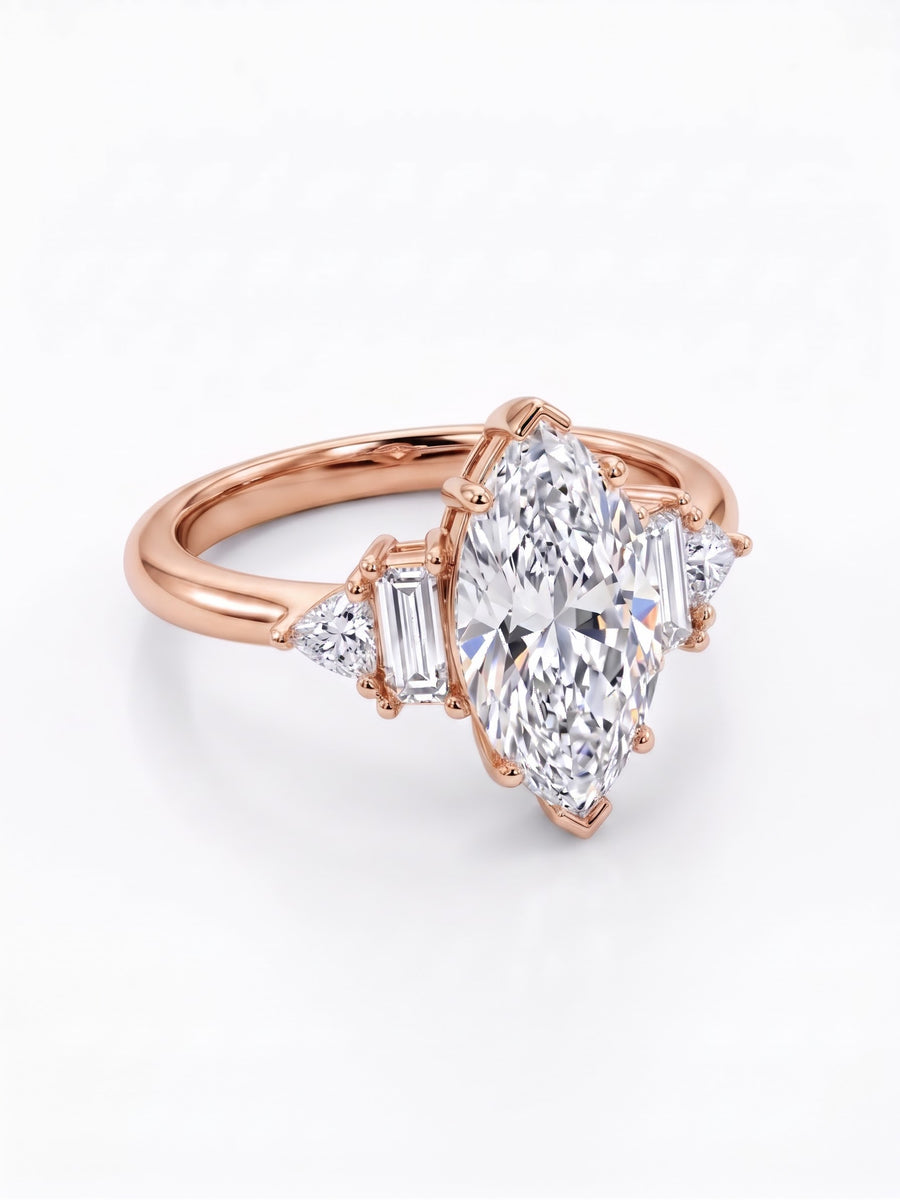 Rose gold engagement ring with a marquise cut center stone, baguette and trillion side diamonds.